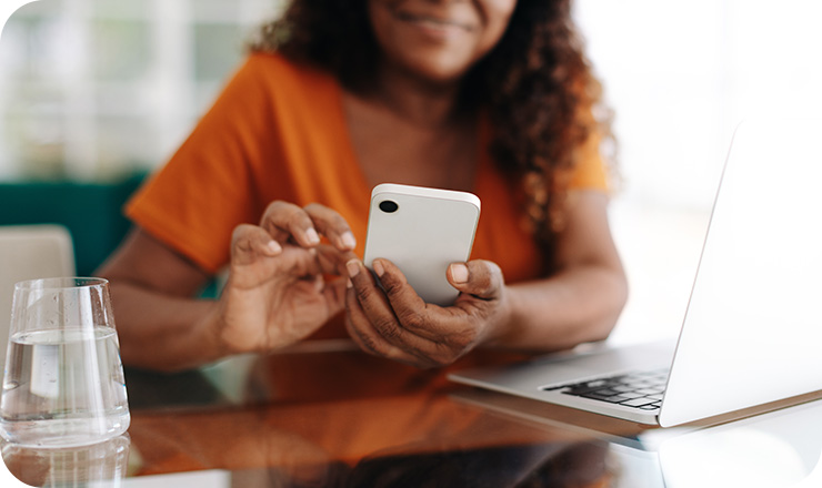 Close up photo of a woman looking at her phone Close up photo of a woman looking at her phone